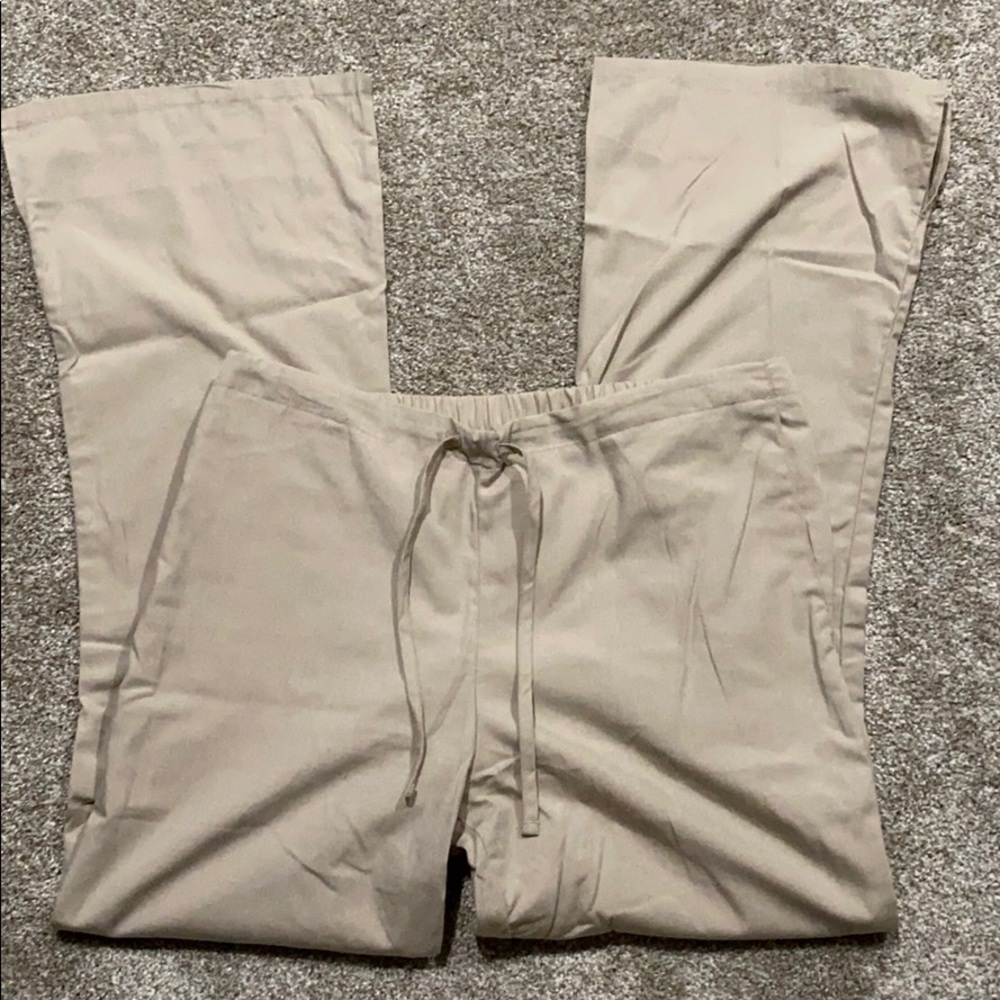 Khaki Cherokee scrub pants.